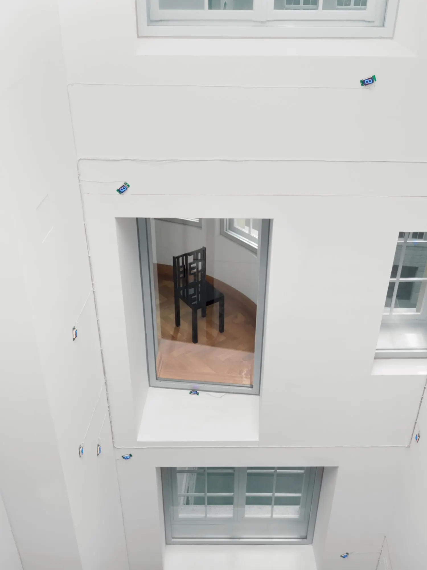 The back frame of each chair incorporates a four letter word.