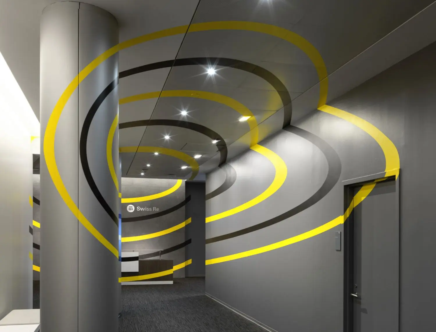 Five yellow and purple ellipses orbiting each other. When seen from the correct angle they seem to float mid-air.